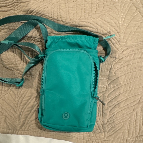 lululemon athletica Handbags - Lululemon Teal Water Bottle Crossbody with Front Pocket 2L